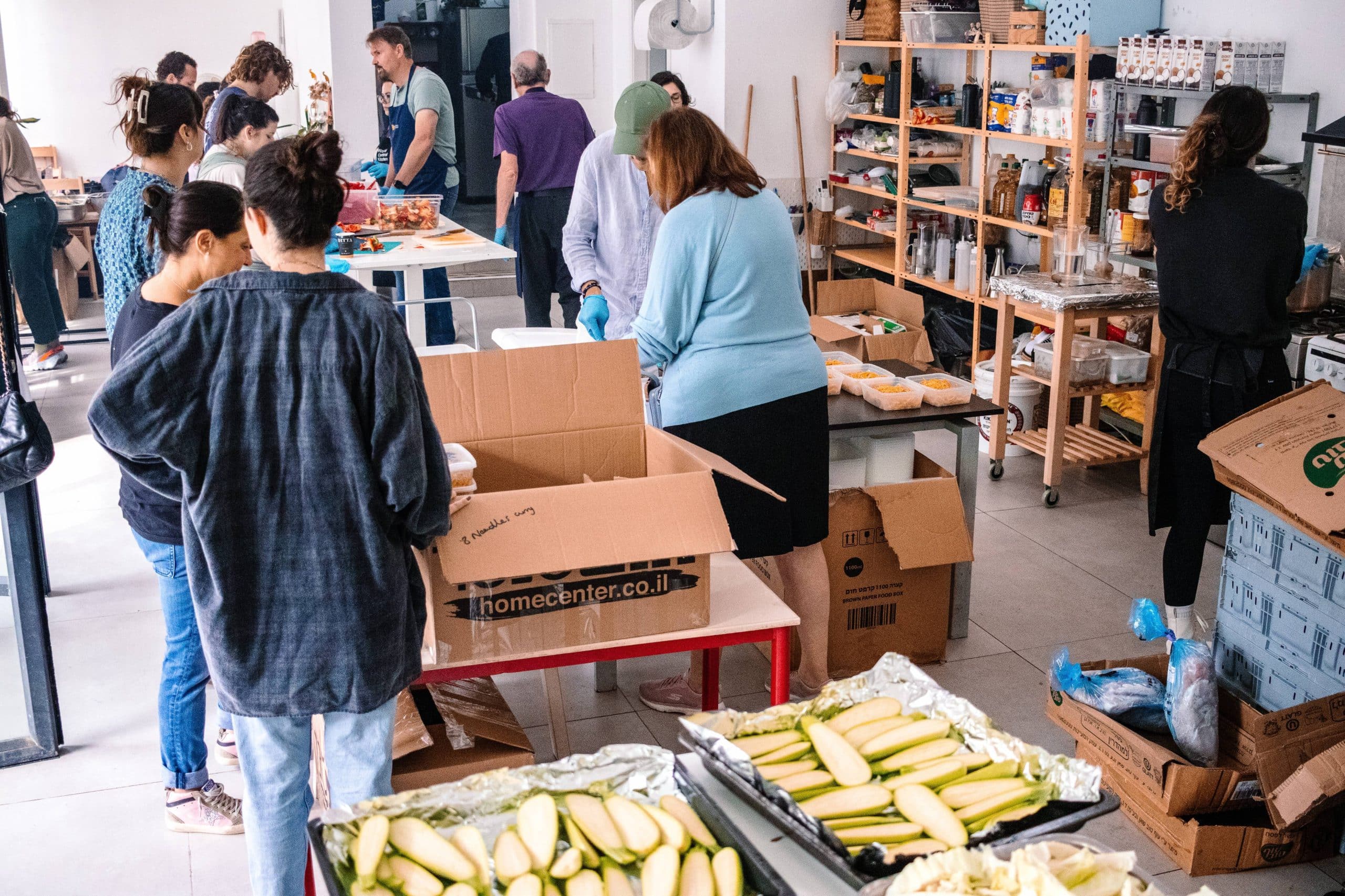 Volunteers in Tel Aviv prepare food for soldiers