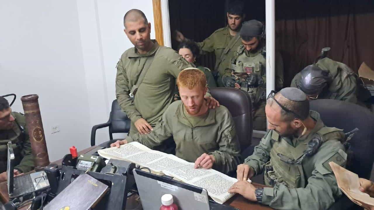IDF soldiers read the traditional Esther Scroll of the holiday of Purim in the Al Shifa Hospital in Gaza