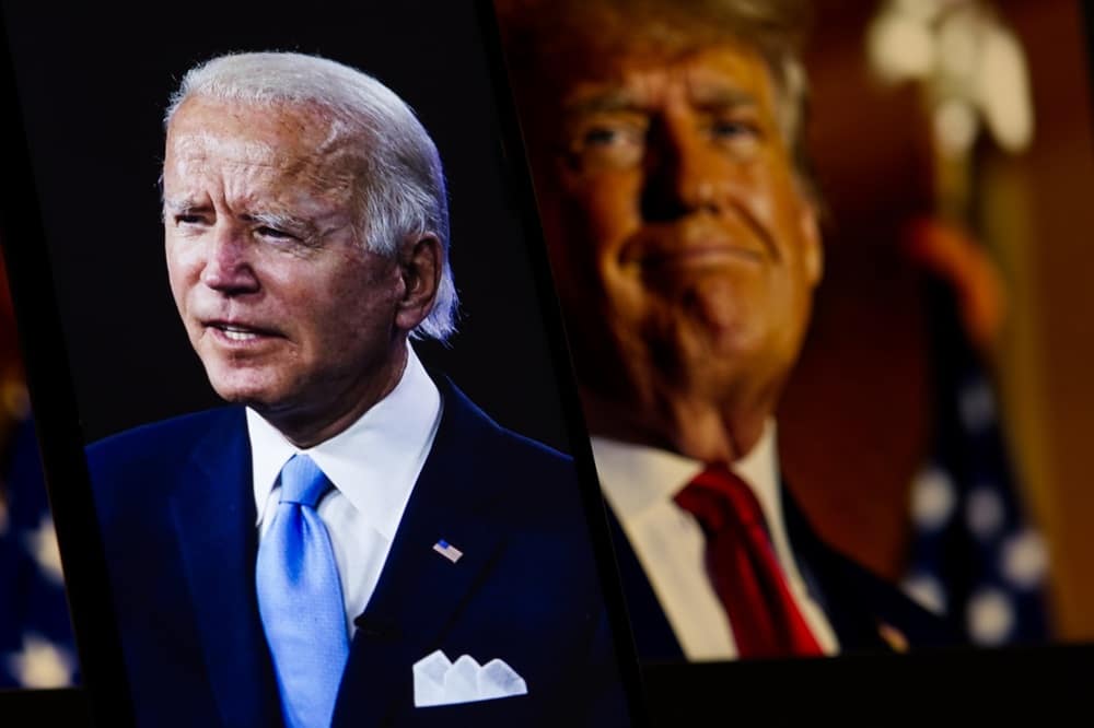 Joe Biden on screen, with picture of Donald Trump in the background