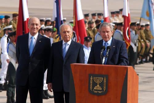 Ehud Olmert, Shimon Peres & George W. Bush behind a podium