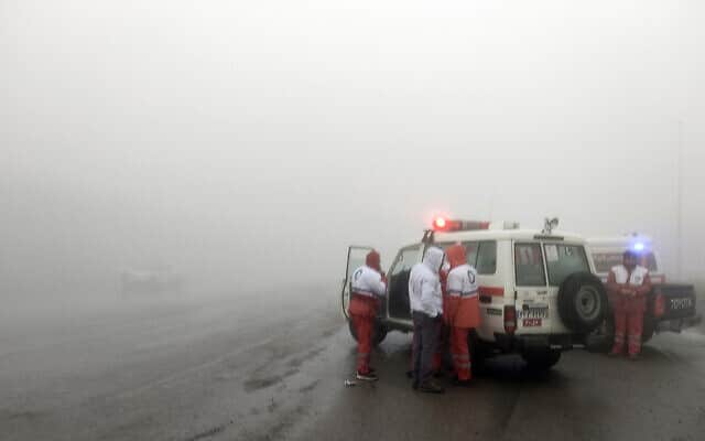 Rescue teams are seen near the site of the incident of the helicopter carrying Iranian President Ebrahim Raisi in Varzaghan in northwestern Iran, Sunday, May 19, 2024.