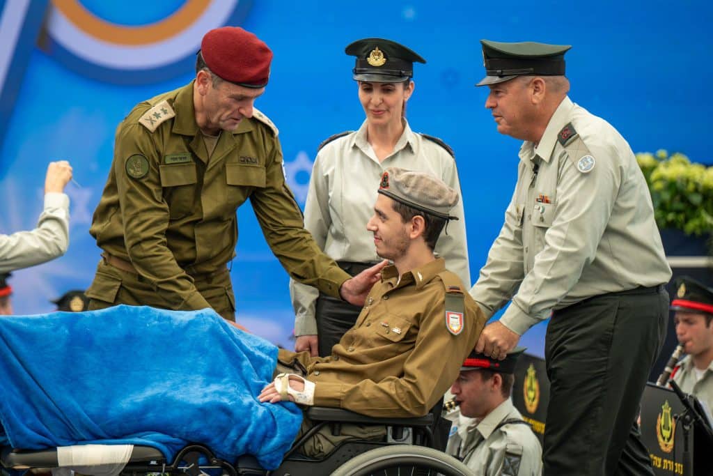 Herzi Halevi, the Chief of the General Staff of IDF greets a soldier at the President's Award for Outstanding Soldiers on Independence Day