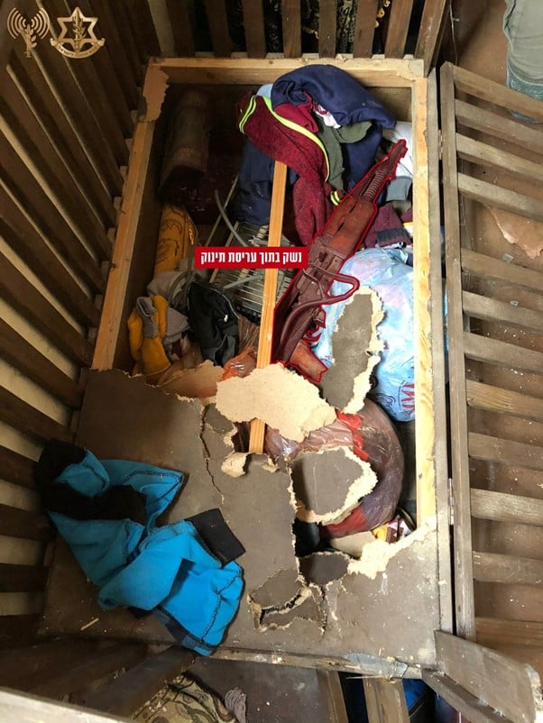 IDF found a rifle and other munitions in a baby crib during one of its raids