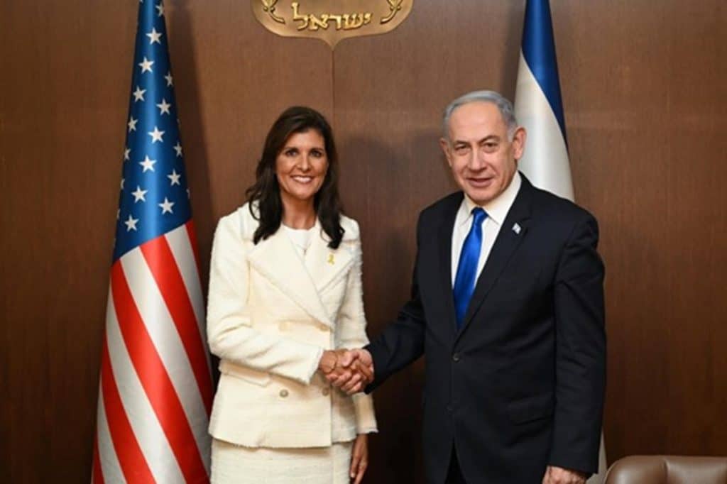 Nikky Haley shaking hands with Benjamin Netanyahu