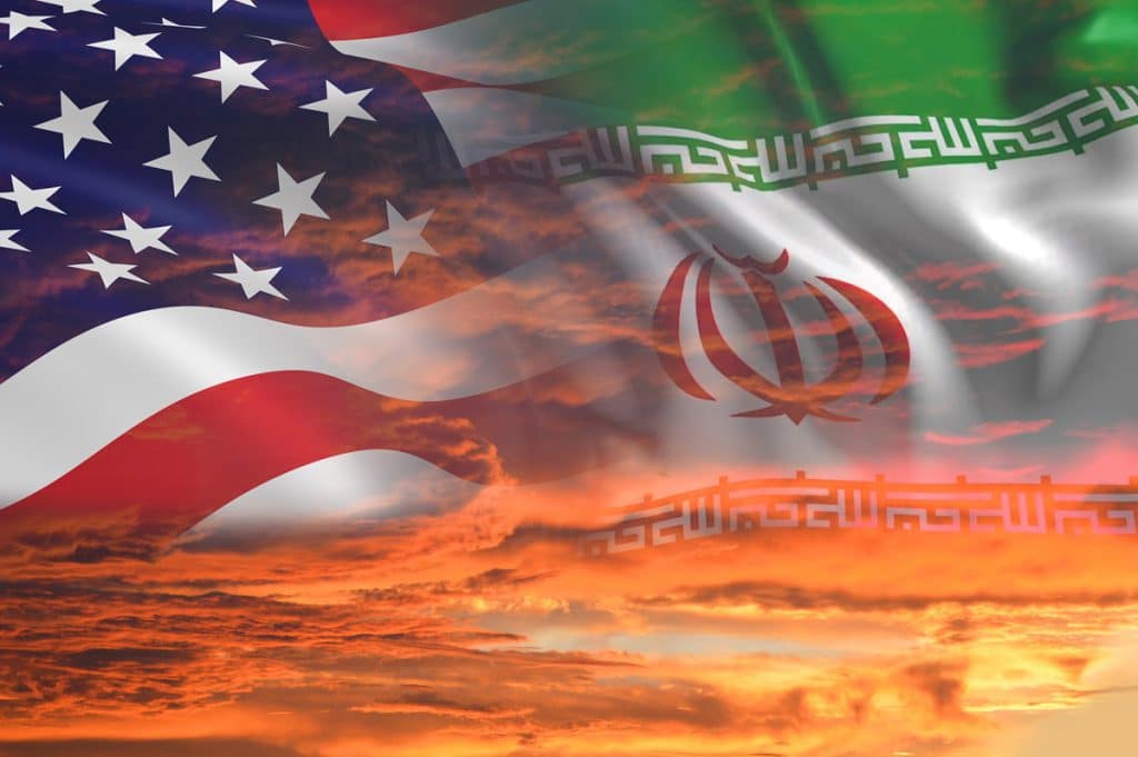 USA & Iran flags on stormy cloudy orange sky background