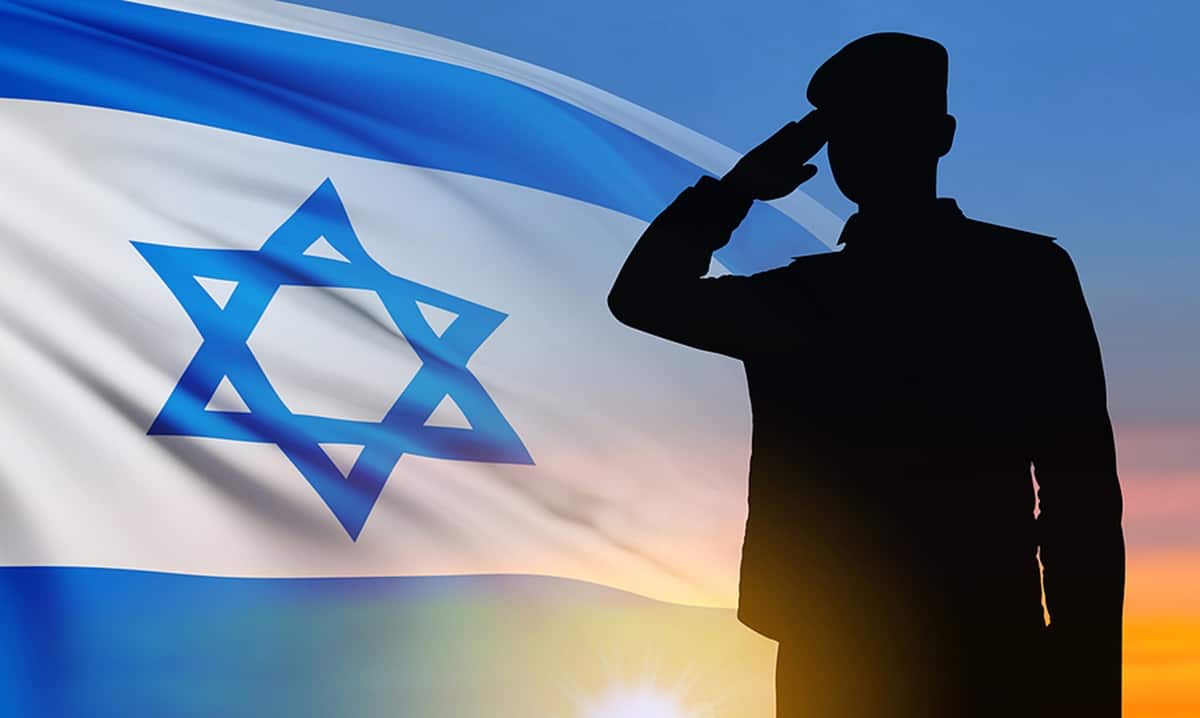 silhouette of a soldier saluting to Israeli flag