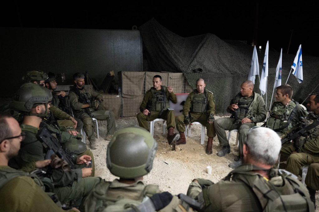 Halevi sitting with soldiers in a circle