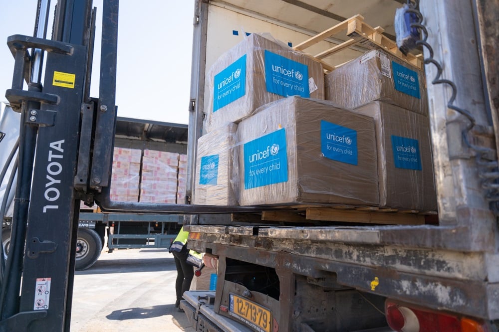 UNICEF crates unloaded from truck