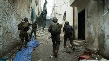 IDF soldiers run in alley