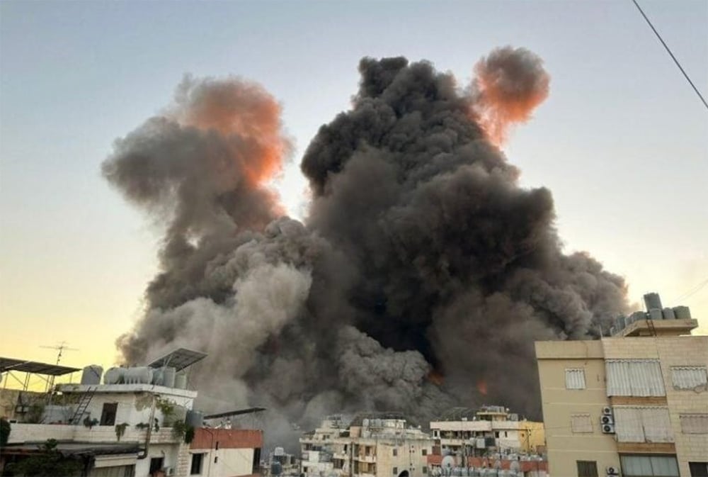 thick black smoke above Dahiya neighborhood