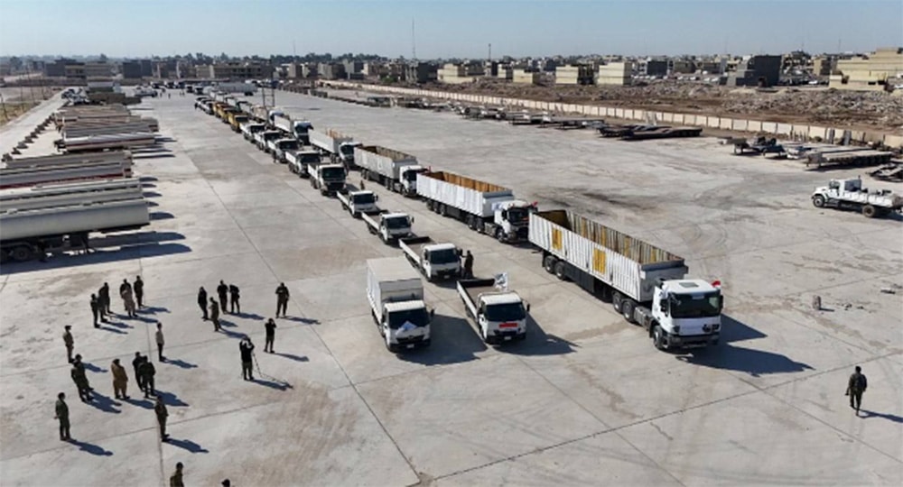 long line of trucks and motorcycles, viewed from above