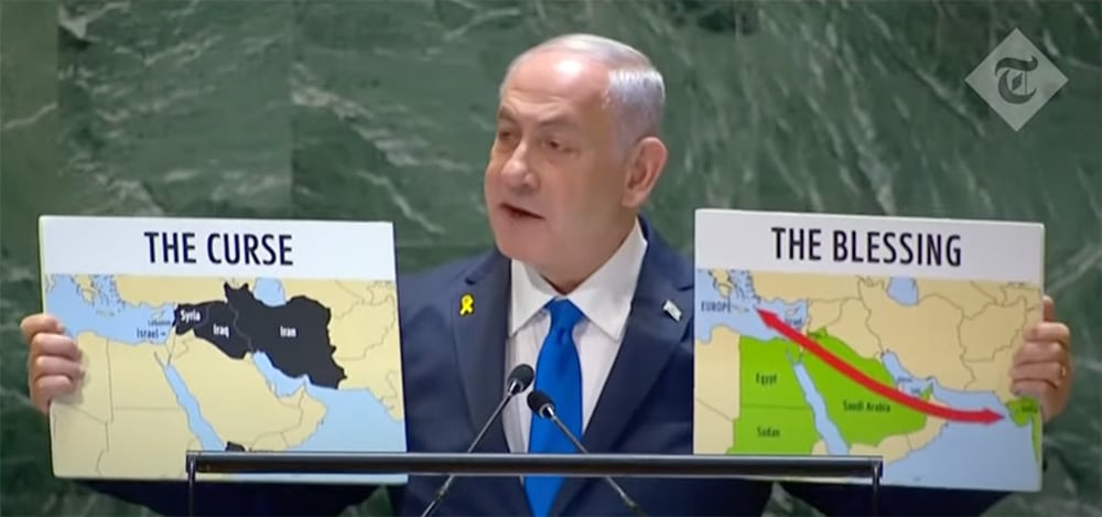 Netanyahu holding signs of 'The curse' countries and 'The blessings'