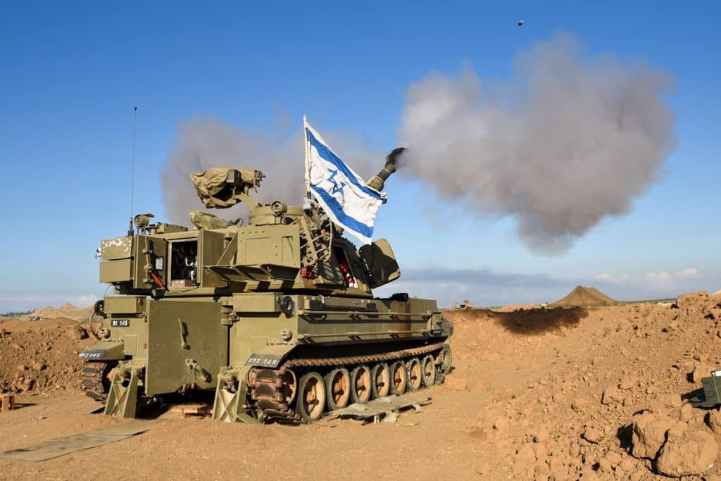 artillery cannon with Gaza in the background