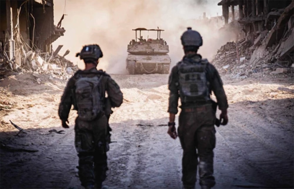 IDF soldiers photographed from back, walk on main street