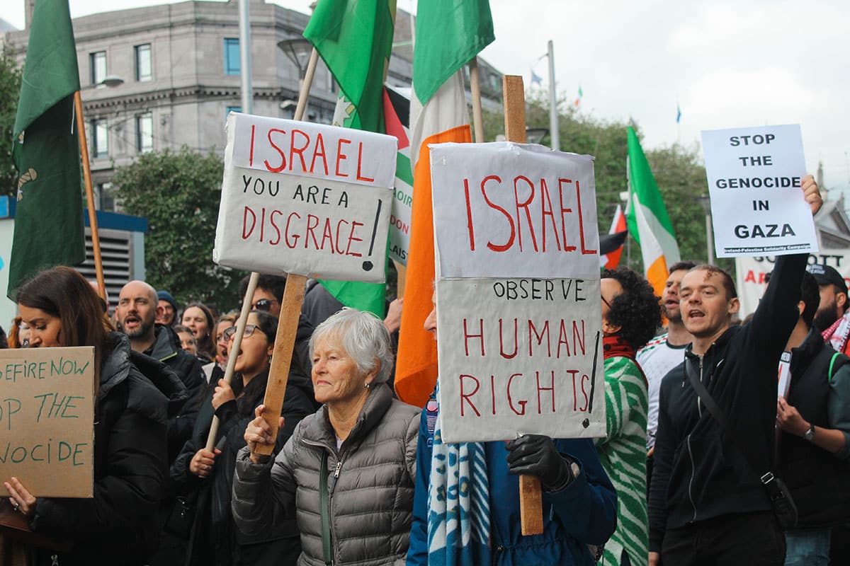 demonstrators with signs against Israel