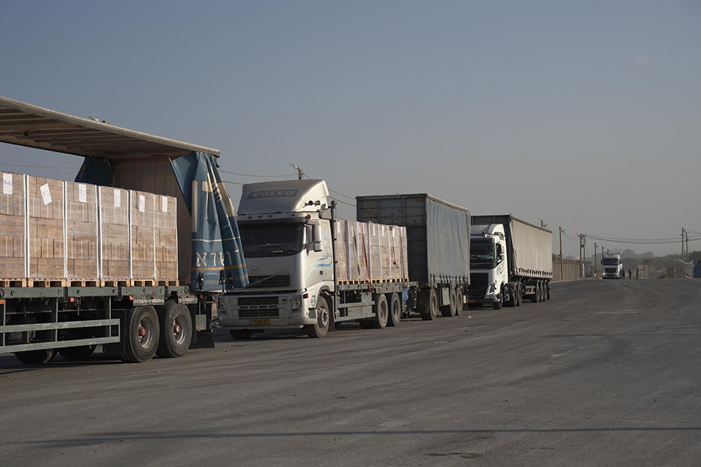 line of trucks next to border