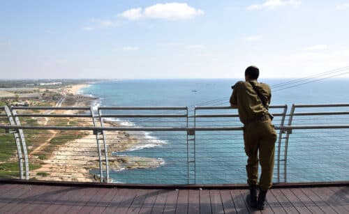 IDF soldier viewing the sea on promenade