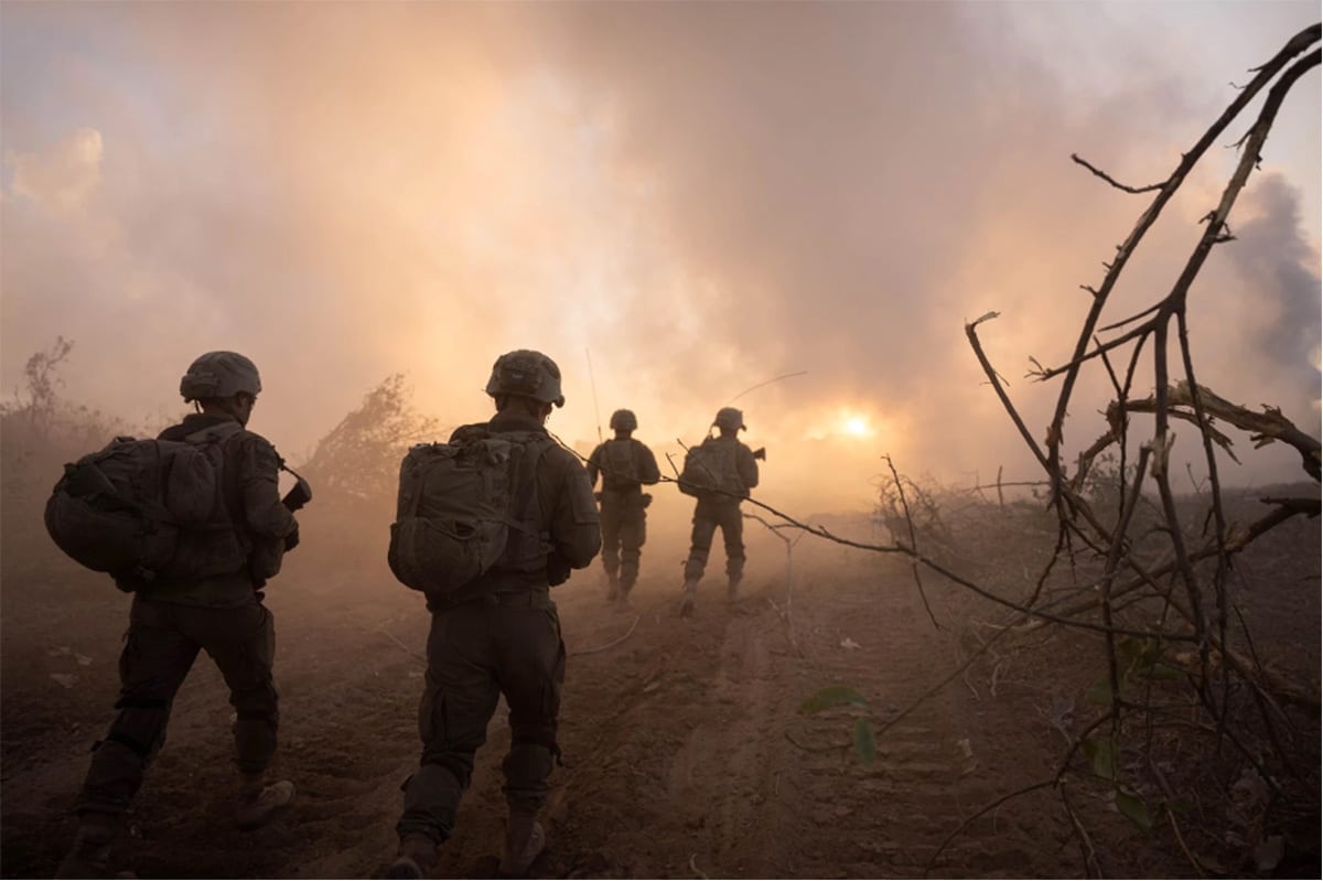 soldiers walking under smokey sky