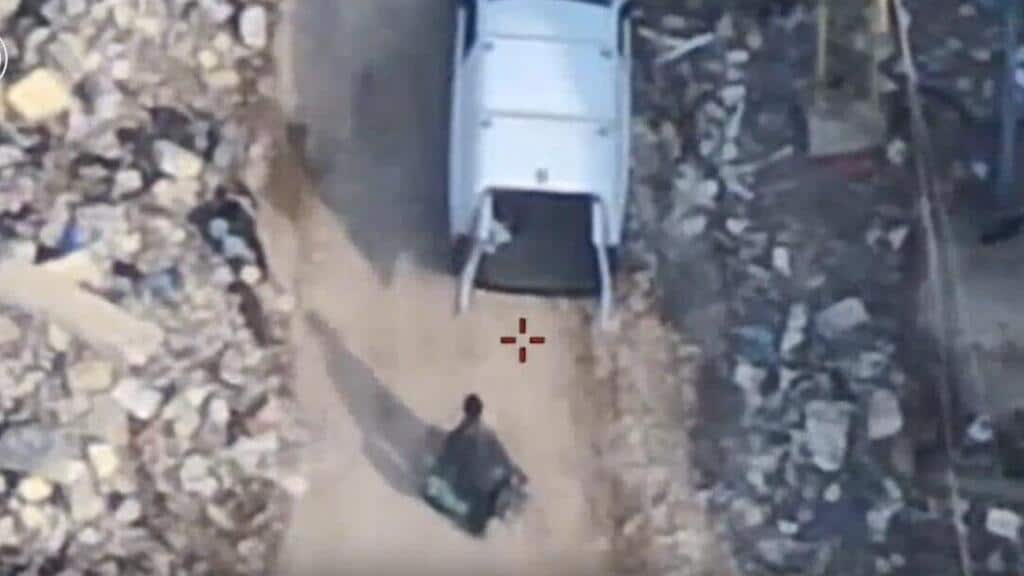 airview of open van and terrorist approaching