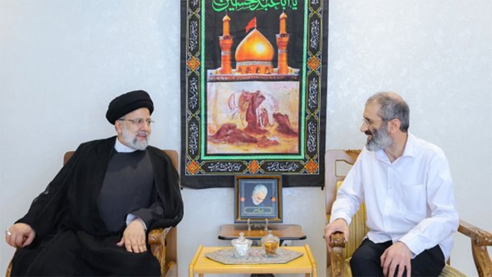 Asadi & Raisi seated meeting