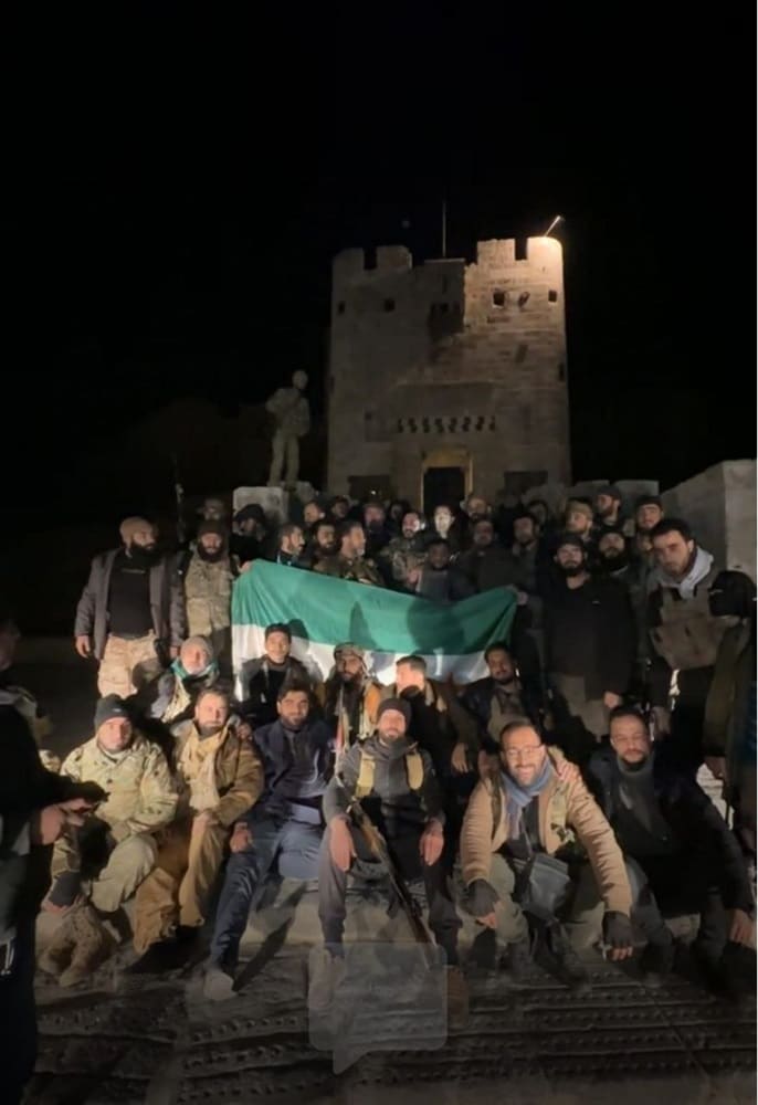 group of rebels near citadel at nighttime