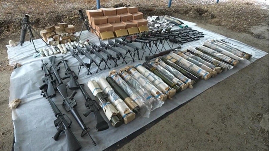 rifles, rockets and weapons presented on ground