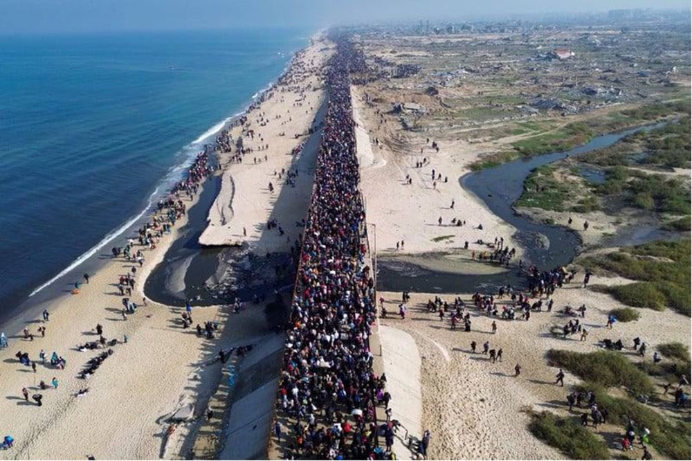 large crowd on road as seen from drone