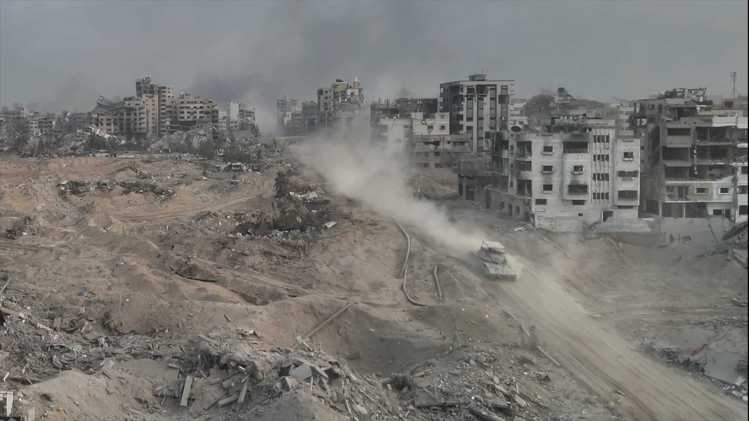 Tank,Driving,With,Dust,In,Al-shati,Refugee,Camp,,Gaza,,Aerial