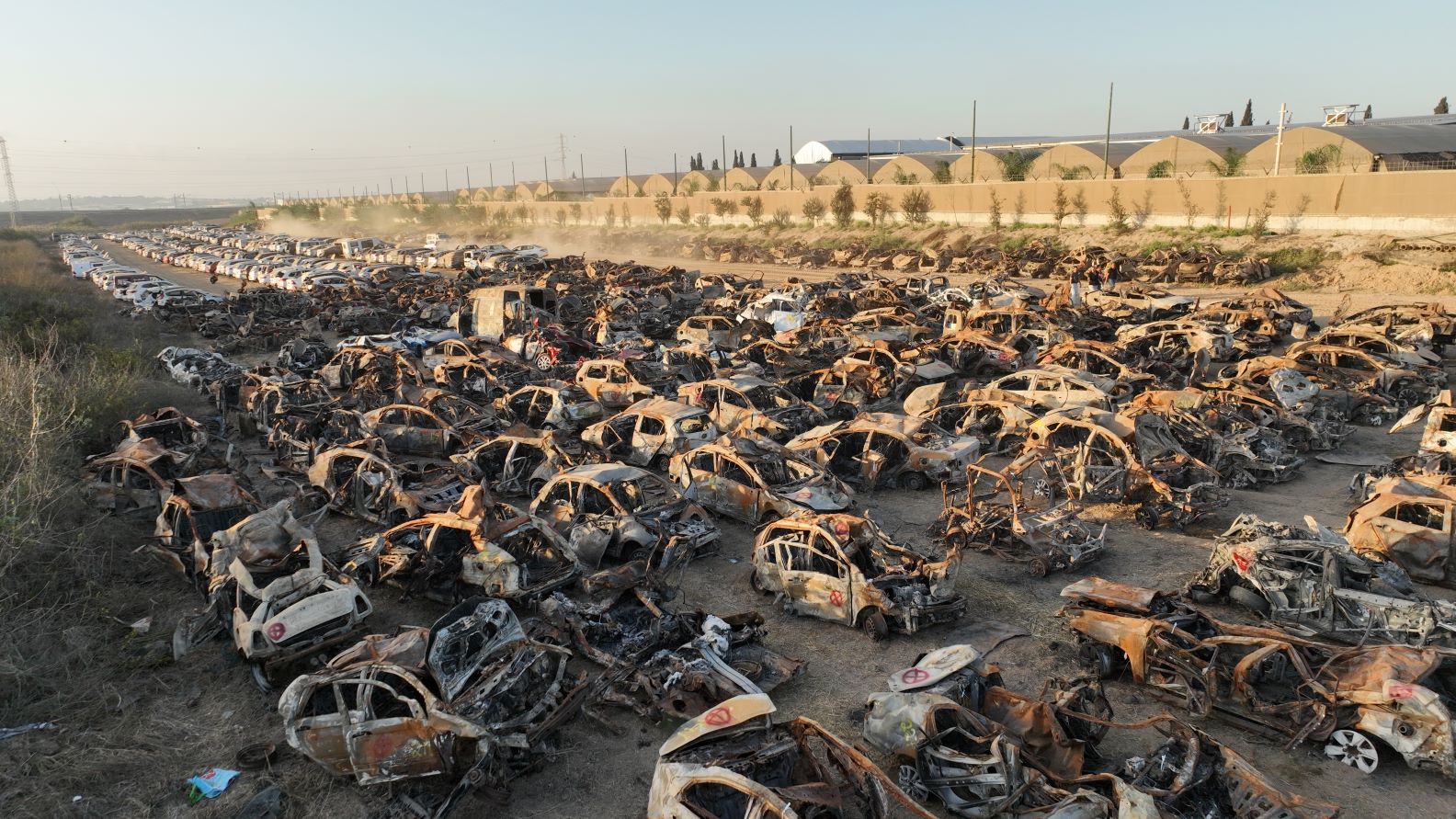 How is it possible that the countries of the world have not woken up to condemn the murderers? Burnt vehicles collected from the Gaza Envelope after the October 7 massacre. Photo: Michel Amzaleg, Government Press Office 